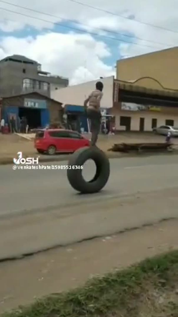 This workshop guy  doing amzing walk on Tyre  in public road
